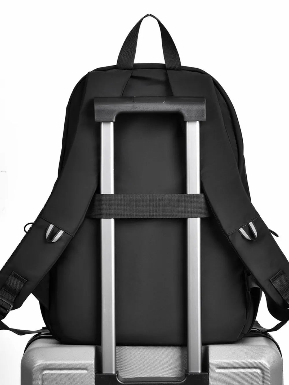Black multi pocket backpack bag designed for easy travel on rolling luggage with adjustable straps